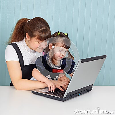 mom teaches daughter to use computer royalty free stock