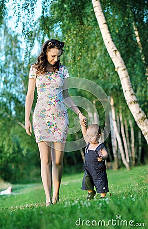 Mom walking with her cute son