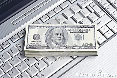 Money lying on a laptop