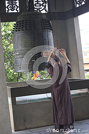A monk ring the bell
