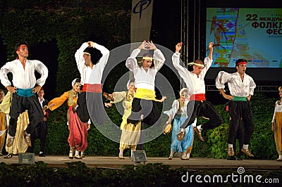 Montenegro folk dance group show on stage