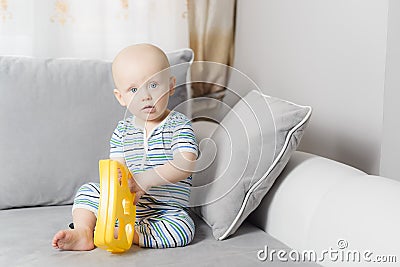 6-month baby boy crying while mother is changing his nappy