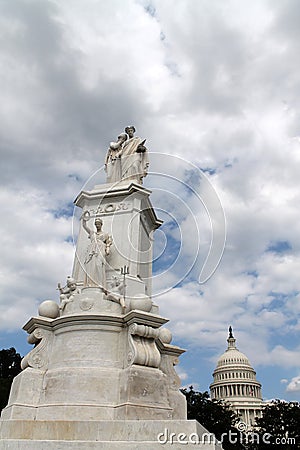 Monument, capitol and puffy clouds
