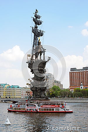 Monument to Peter the Great, a cruise ship sails on the Moscow river.