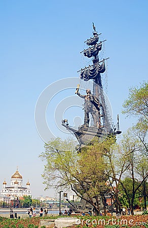 Monument to Peter the Great, people walk by it.