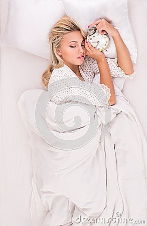 Morning of young beautiful woman in bed