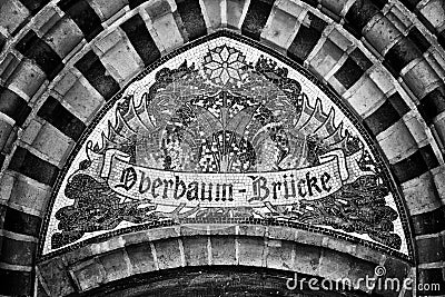 Mosaic. Pointer to name the bridge Oberbaumbruecke. Berlin. Germany.
