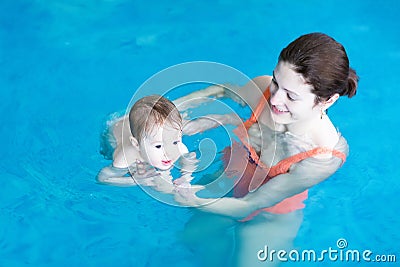 Mother and baby playing in a swimming pool