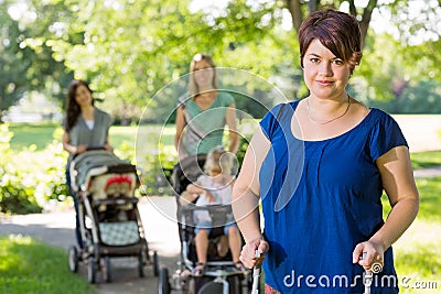 Mother With Baby Stroller At Park