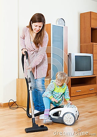 Mother with child cleaning home