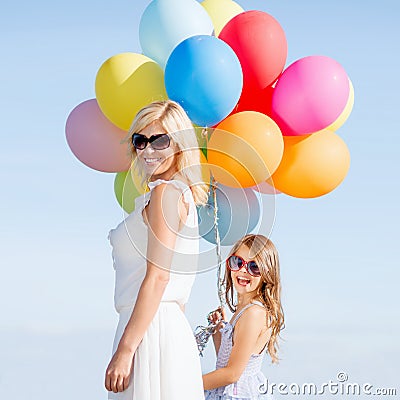 Mother and child with colorful balloons