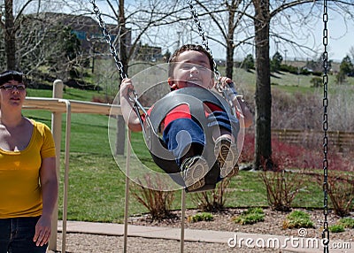 Mother and child on a swing