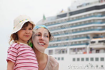 Mother and daughter, cruise ship on background