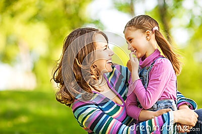 Mother and daughter in park