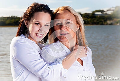 Mother and daughter posing in the summer sun