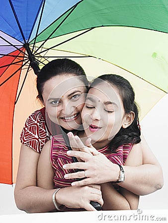 Mother and daughter in rain