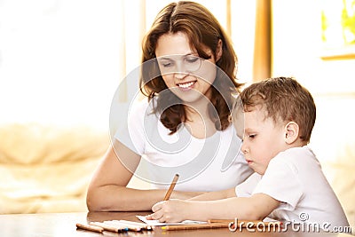 Mother helping in homework to her son