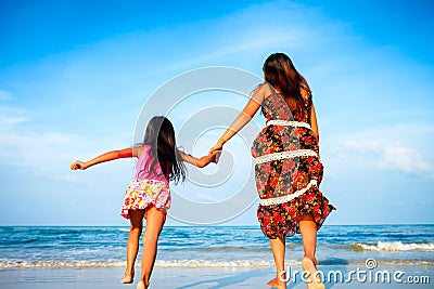 Mother and her daughter running together