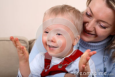Mother hold handicapped boy
