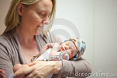 Mother Holding Her Newborn Baby