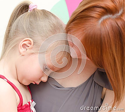 Mother hugging sad child