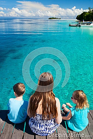 Mother and kids enjoying ocean view