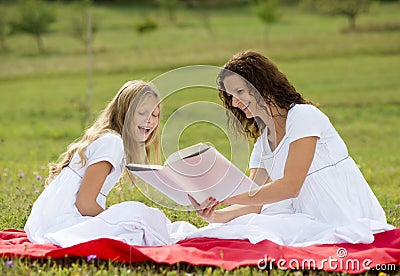 Mother and kids reading a book