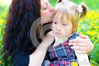 Mother kisses daughter