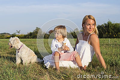 Mother, son and cute dog outdoors