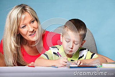 Mother and son drawing together