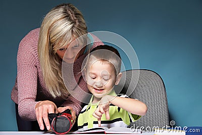 Mother and son drawing together