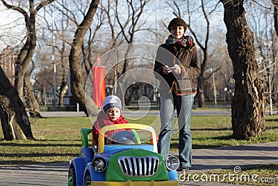 Mother with son riding car