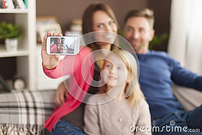 Mother taking photos of her family