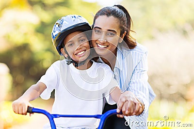 Mother teaching son bike