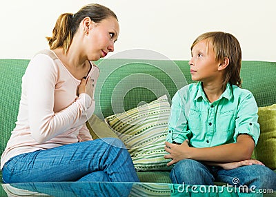 Mother with teenager son having serious conversation