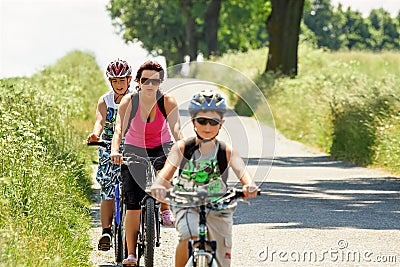 Mother with two sons on bicycle trip