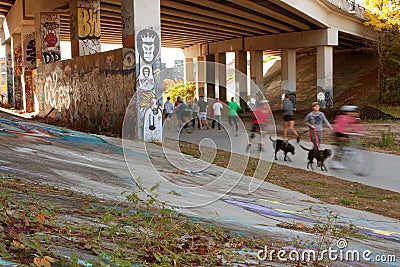 Motion Blurred Composite Of People Exercising In Urban Setting