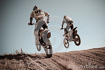 Motocross riders on the race