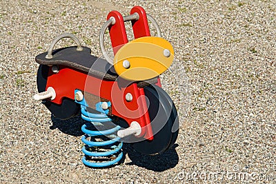 Motorbike spring toy in playground