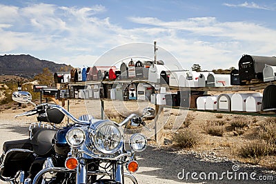 Motorcycle in front of rural mailboxes