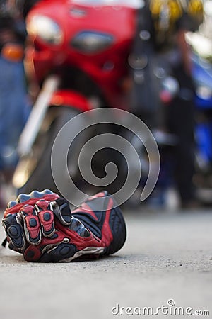 Motorcycle Gloves against a motorcycle