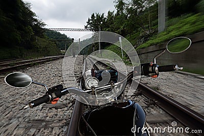 Motorcycle moving on a railroad