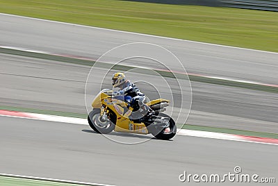 A motorcycle runs at Montmelo Circuit de Catalunya, a motorsport race track