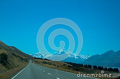 Mount Cook and Empty Road on a Sunny Day