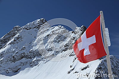 Mount Jungfrau behind the flag of Switzerland