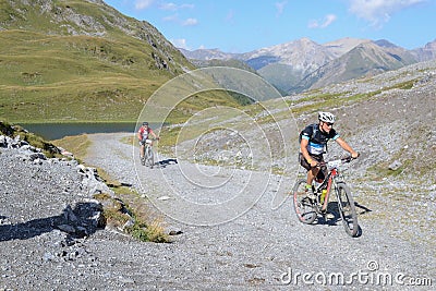 Mountain bikers riding though Swiss mountain area