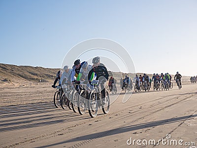 Mountain bikers taking part in the beach race Egmond-Pier-Egmond