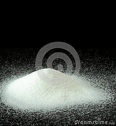 A Mountain of Granulated Sugar on a Black Background