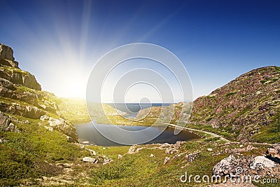 Mountain lake in the North. Moss-covered hills, and stunted vege