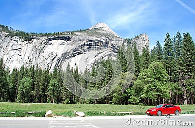 Mountains landscape with red sport car